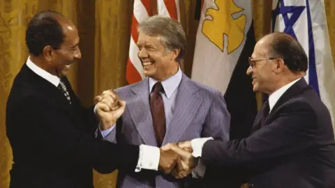 Getty Images President Sadat, President Carter and Prime Minister Begin