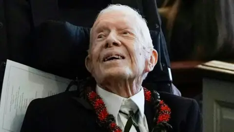 Getty Images Jimmy Carter photographed at his wife Rosalynn's funeral in 2023