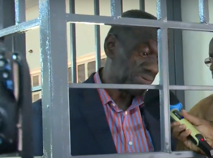 Kizza Besigye speaking to the press from a cage within a military court on November 20, 2024. PHOTO/Screengrab by K24 Digital/YouTube