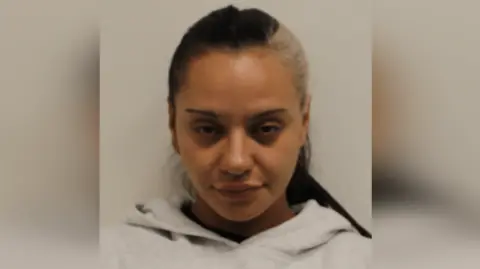 Met Police Custody photo of Linda De Sousa Abreu in a grey hoodie