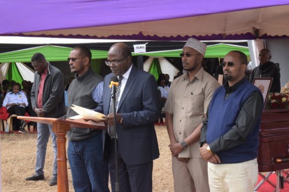 Chebukati and other commissioners speaking during the burial of Daniel Musyoka. PHOTO/@IEBCKenya/X